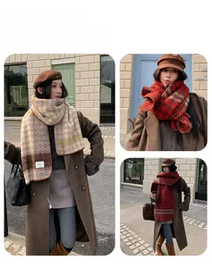 Detail view of houndstooth scarf and beret hat with versatile styling for winter