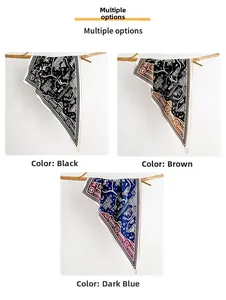 Detailed texture of printed silk neck scarves in black, brown, and deep blue colors