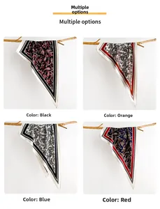 Selection of colorful paisley pattern triangle scarves in black, orange, blue, and red silk