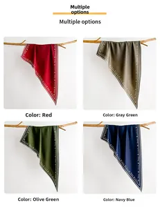 Detail view of silk scarves in red, navy, grey and fruit green with letter print