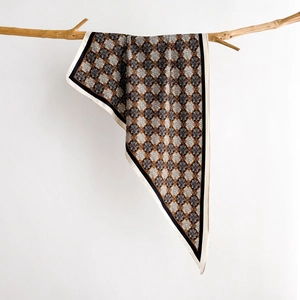 French vintage floral silk scarf with geometric prints on a natural wooden branch