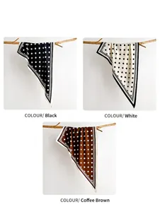 Close-up of polka dot scarves in black, white, and coffee brown with silk-like satin finish