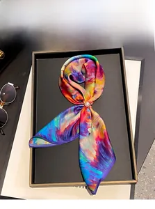 Detail of 100% mulberry silk scarf with artistic print and elegant pearl decorative ring