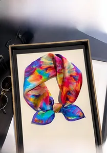 Detailed shot of 100% mulberry silk scarf with colorful oil painting print tied in a bow