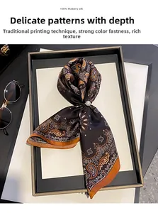 Detail view of 100% Mulberry silk scarf with vintage orange paisley print on dark brown
