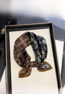 Detail showing high-quality mulberry silk scarf with vintage paisley patchwork pattern