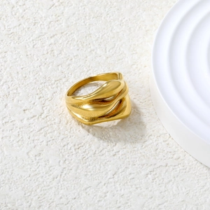 Irregular 18K gold stainless steel ring with multi-layered wave design and textured finish