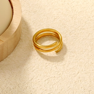 Macro shot of 18K gold plated stainless steel triple spiral ring with smooth finish