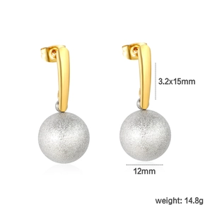 Detail of two-tone oval twist earrings with gold hoops and 12mm silver frosted spheres
