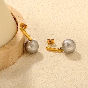 Modern two-tone hoop earrings with gold plated pins and frosted silver sphere dangles