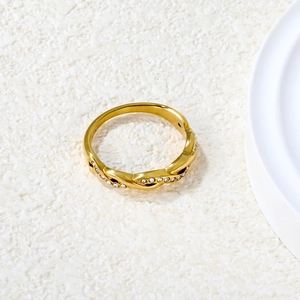 Golden braided twist ring with double row white crystals in polished stainless steel