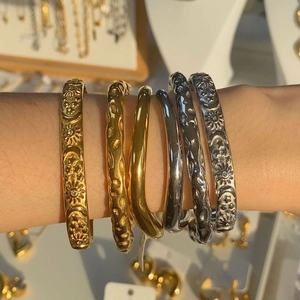 Irregular textured gold and silver plated crossover bangles with sun moon embossing