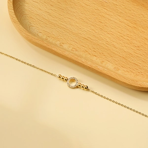 Tobillera de acero inoxidable chapada en oro de 18K con colgante de círculo y cristal