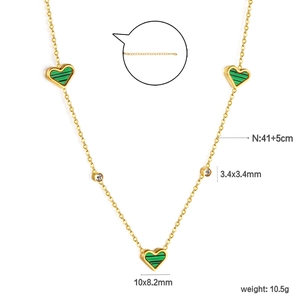 Elegant gold heart necklace with striped malachite pendants and crystal accents