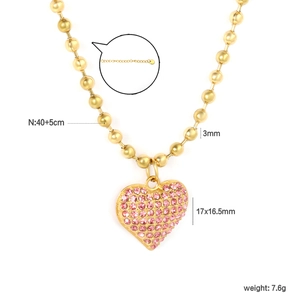 Gold beaded necklace with a pink rhinestone heart pendant and dimension parameters
