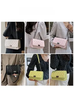 Quilted flap bag display in multiple colors with chain strap and metallic twist lock