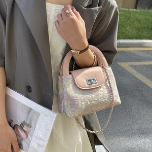 Chic pink quilted texture bucket bag with silver twist lock and chain strap
