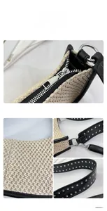 Close-up of woven texture and adjustable strap with silver metallic rivets on handbag