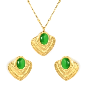 Golden jewelry set featuring emerald cat eye stones and heart pattern necklace and earrings