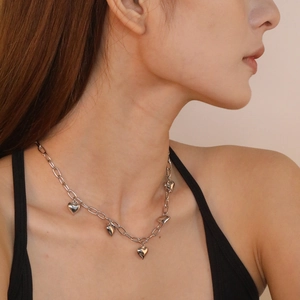 Polished stainless steel chunky chain necklace featuring five 3D heart-shaped pendants