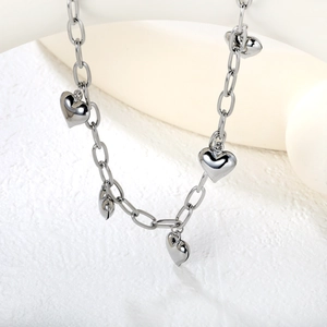 Polished silver stainless steel link chain necklace with multiple heart pendants