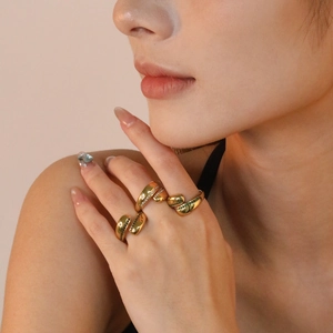 Detailed view of vintage gold emerald rings set with pave crystals and black stones