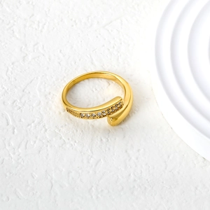 Detailed macro view of gold bypass ring featuring two rows of pavé set crystals