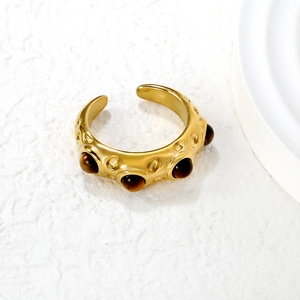 Adjustable gold irregular hammered ring with five inlaid brown tiger eye gemstones