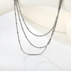 Three-layer silver steel herringbone chain necklace with minimalist small beads detail
