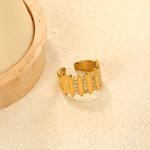 Detail of gold-plated stainless steel ring featuring multi-row crystal rhinestones