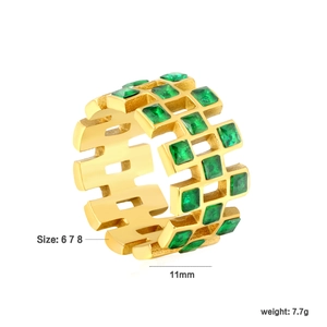 Detailed view of 18k gold plated stainless steel ring with green stones and 11mm width