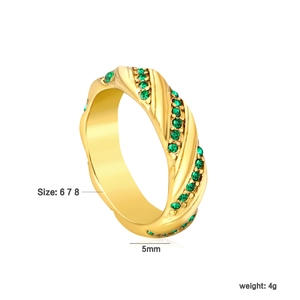Detailed view of 5mm gold twisted ring with dual rows of green round-cut gemstones