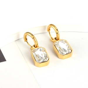 Detail of 18K gold-plated rectangle hoop earrings with emerald-cut cubic zirconia