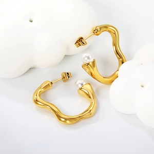 Irregular wavy C-shape gold earrings with white pearls and butterfly back fasteners