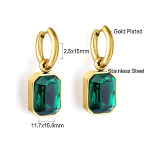 Detail of 18K gold plated stainless steel hoop earrings with green emerald-cut stones