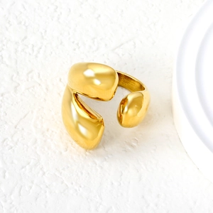 Irregular fluid waterdrop open ring in 18K gold plated stainless steel on white pedestal