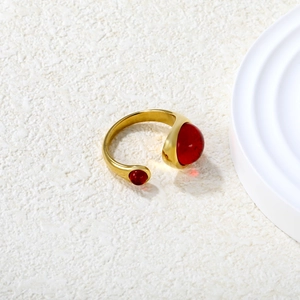 18k gold plated stainless steel open ring featuring two asymmetrical red ruby stones