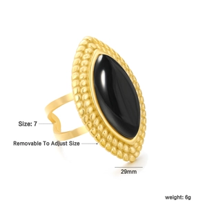 Macro shot of 29mm black agate marquise ring in gold finish with heart-shaped details