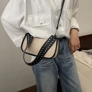 Straw shoulder bag with black leather trim and double row silver studs for women