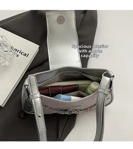 Macro shot showing the spacious interior and ample storage of this silver chain shoulder bag