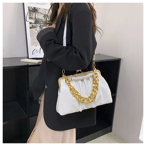 White pleated cloud bag with chunky gold chain handle shown on a model side view