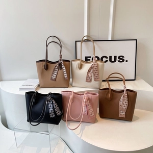 Large capacity tote bags in multiple colors featuring chic textured leather and scarves
