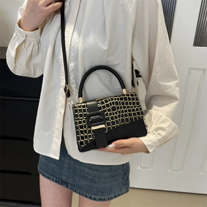 Chic black mini crossbody bag with crocodile texture flap and gold hardware accents