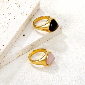 Retro vintage gold rings set with natural tiger eye and agate on stone props