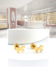 Close-up of 18K gold plated horse-shaped stud earrings with secure screw backings