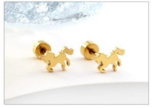 Detail of 18K gold plated unicorn stud earrings with polished stainless steel finish