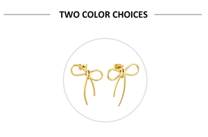Detailed view of polished 18K gold plated bow earrings with dangling metal tassels