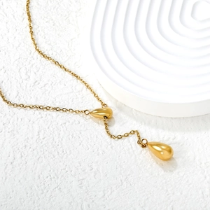 Minimalist gold double teardrop pendant necklace with a polished matte finish for women
