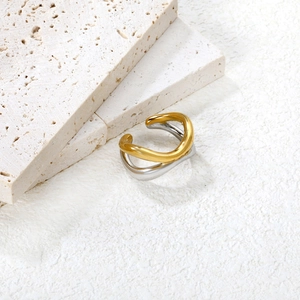 Detailed close-up of 18K gold and silver plated irregular wavy stainless steel ring