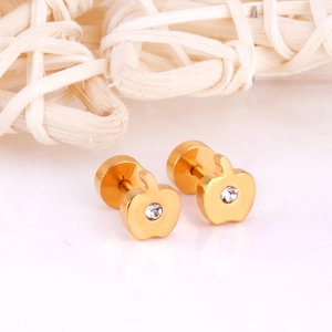 Detailed close-up of gold-plated apple stud earrings with a central sparkling crystal accent